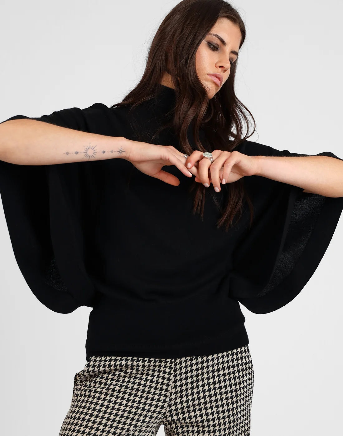 
                  
                    Batwing Roll Neck Merino Sweater
                  
                